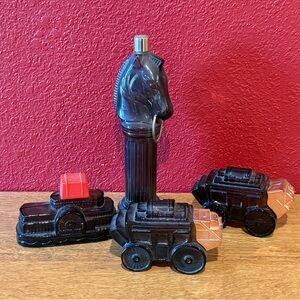 Four empty Avon perfume decanters